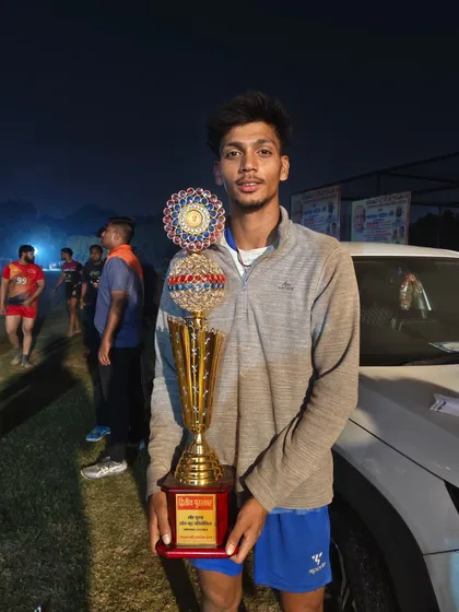 Another shot of our player with the runner-up trophy. This represents the dedication and fight our team showed throughout the tournament.