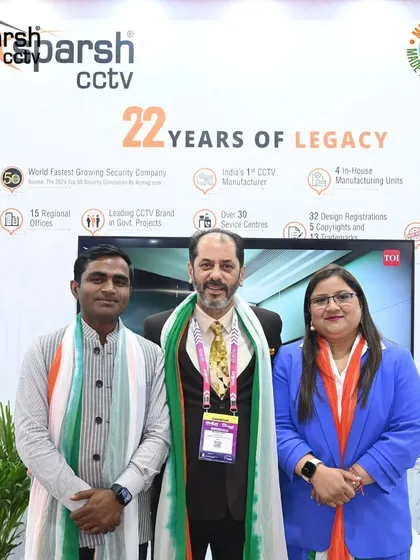 A moment of pride for our team at IndiaSoft & Convergence 2025, standing before our legacy wall showcasing 22 years of innovation.