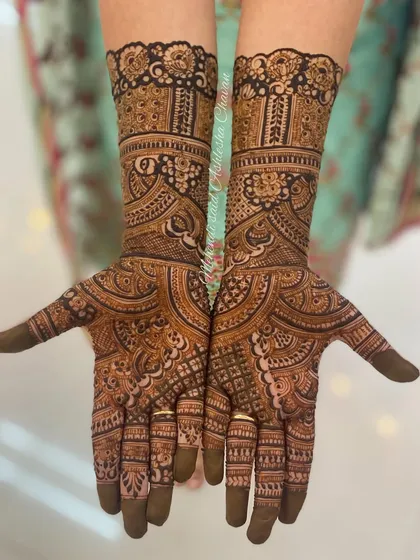 A classic, full-coverage mehendi design. The patterns are traditional and intricate, providing a timeless look for any celebration.