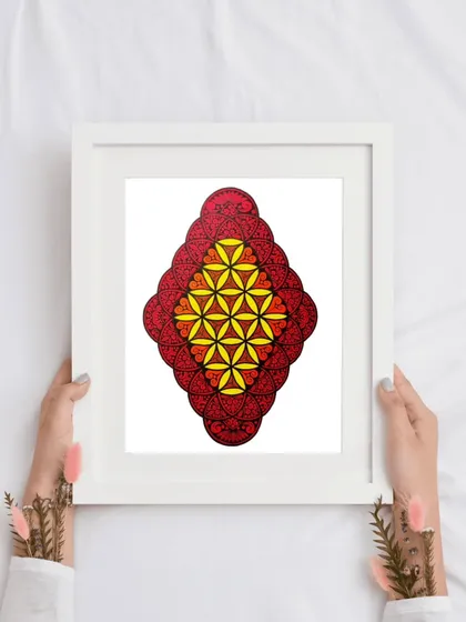 Holding the framed mandala artwork. This gives a sense of its scale and shows it ready to be gifted or hung.