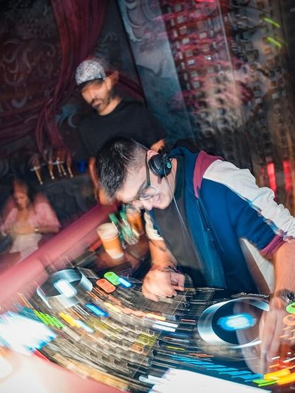 A long-exposure shot capturing the energy and movement of a dynamic set at Takumi.