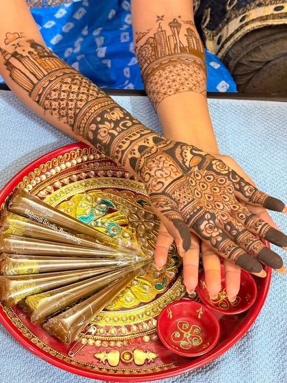 A view of the bride's hands with my tray of fresh, organic henna cones.