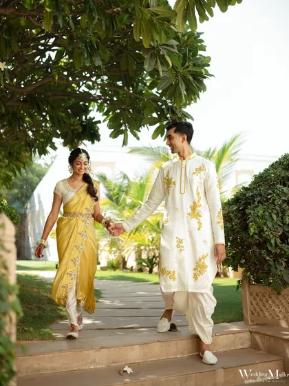 The couple taking a stroll in the gardens of the Radisson Blu Udaipur during their Haldi ceremony. A moment of calm before the fun begins.