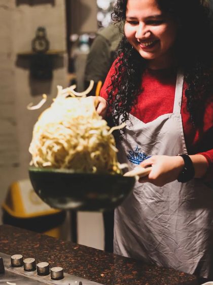 The thrill of a successful noodle toss! Our hands-on classes are filled with moments of fun and accomplishment.