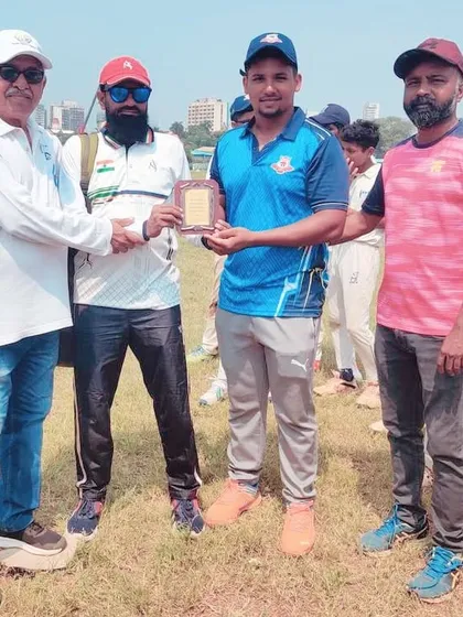 Receiving the participation memento at a U-14 tournament. These events are crucial for grassroots cricket development.
