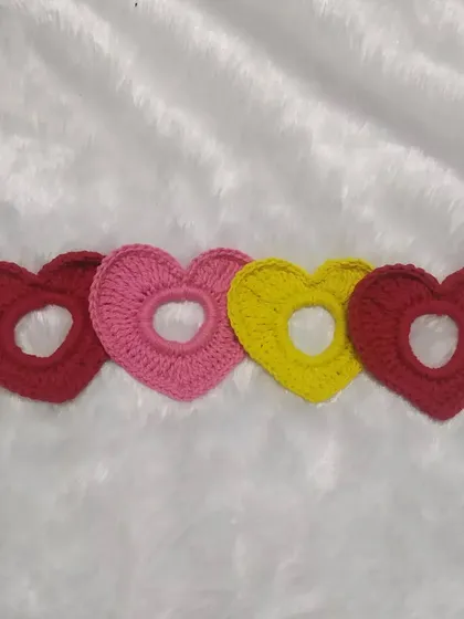 A collection of the heart scrunchies, showing some of the different colors available.