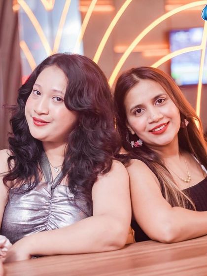 Friends enjoying the party and posing for a photo.