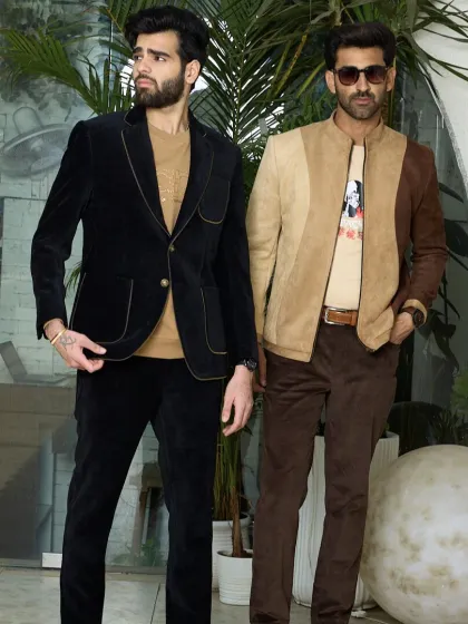 A full-length view of two distinct styles: the black corduroy suit and the two-toned suede jacket with corduroy pants. This demonstrates how I create cohesive yet individual looks.