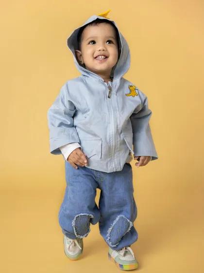 A duplicate of image 24, showing a joyful toddler walking with a big smile.