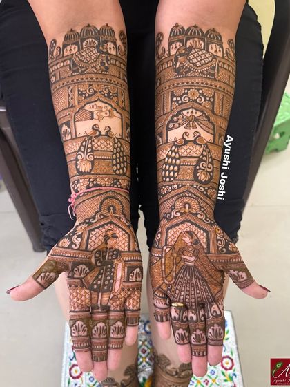 A clear, straight-on shot of the intricate bridal mehendi featuring multiple wedding rituals.