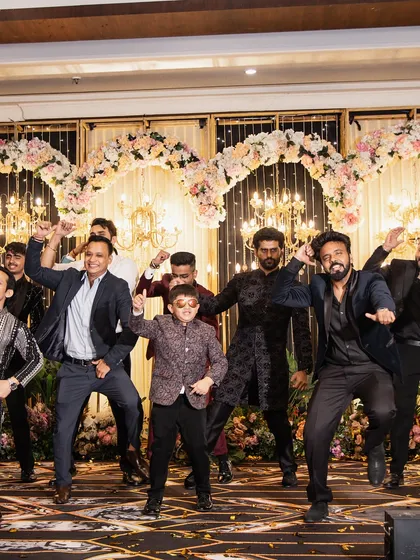 The entire groom's squad, from young to old, coming together for a power-packed performance.