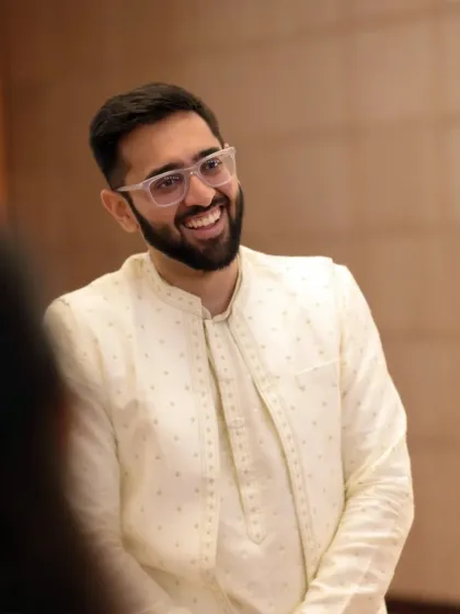 A candid portrait of the groom, capturing his genuine smile and happiness during the Roka ceremony.