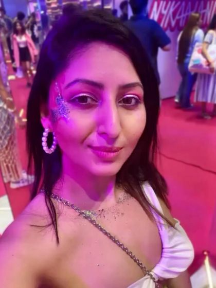 A silver glitter starburst design at the Nykaaland event. This look is pure glamour and perfect for a beauty festival.