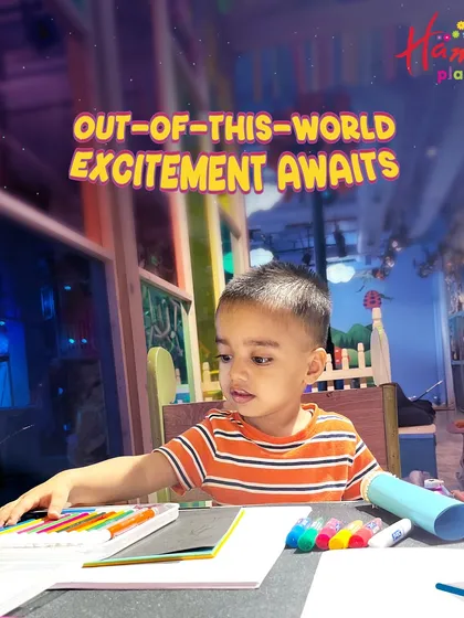 Out-of-this-world excitement awaits! A young boy is deep in concentration while working on his space-themed craft. Our workshops are designed to fuel curiosity and creativity.