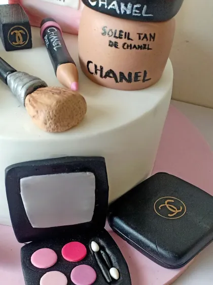 A detailed close-up of the edible Chanel makeup. You can see the texture on the makeup brush and the different shades in the eyeshadow palette.