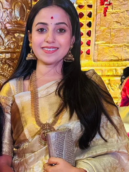 A close-up of Soundarya, her happy expression and the shimmering saree making for a perfect picture.