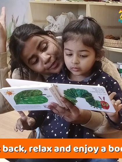 Sometimes, all you need is a good book. I encourage parents and toddlers to sit back, relax, and enjoy a story together in our cozy reading corner.