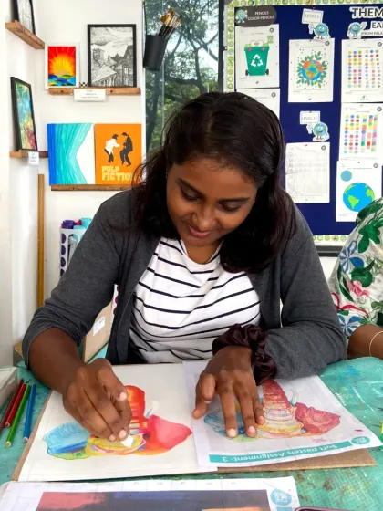 A student in our short-term course uses oil pastels to create a colorful still life.