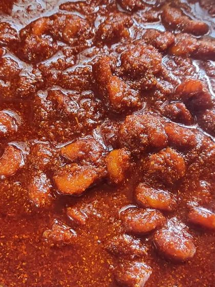 My homemade prawn pickle, rich in color and flavor. This is a favorite among my customers for its spicy kick and authentic taste.