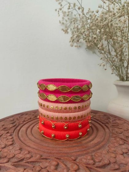 A beautiful set of bangles in shades of pink and red. I used different techniques here, including gota patti and simple beadwork, to create a varied and interesting stack.
