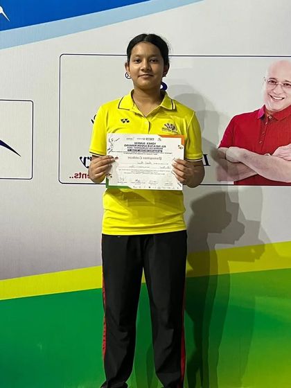 **Bronze Medal at All India Sub-Junior Ranking.** Aanya Bisht proudly displays her certificate after winning a bronze medal in the U-17 Girls' Doubles at the tournament in Vijayawada.