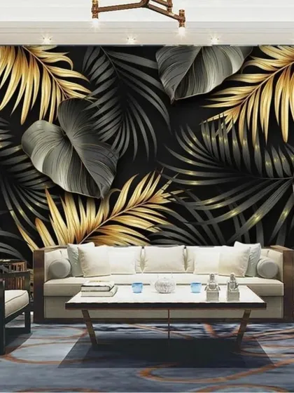 A luxurious and dramatic wallpaper with large black and gold tropical leaves, perfect for a high-end, modern interior.