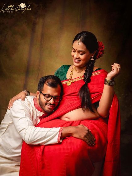 A playful and tender moment where the father-to-be rests his head on the baby bump. It’s these unscripted interactions that make a traditional photoshoot so special.