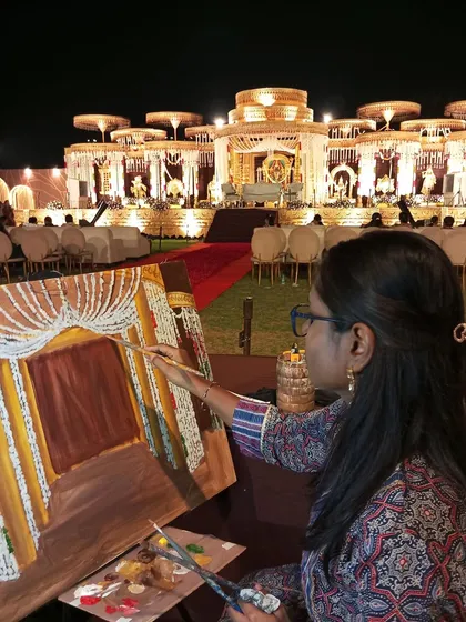 Here I am at work, painting the background of a grand wedding in Raipur before the main event begins. My setup is professional and unobtrusive, adding a touch of artistic flair to the celebration.