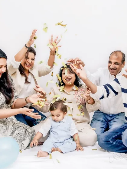 A first birthday celebration with the whole family is chaos and confetti, and I love every second of it. This shot captures the shared joy and energy of three generations celebrating a precious milestone together.