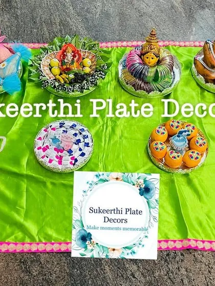 A vibrant platter arrangement on a bright green cloth for a baby shower in Avinashi. The colors and fresh items bring so much energy to the celebration.