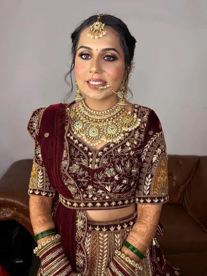 A front-facing view of this stunning bride. The halo eye makeup draws attention to her eyes, while the nude lips provide a perfect balance to the overall look.