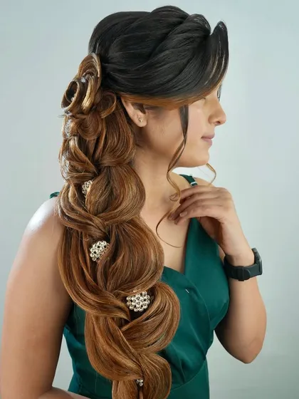 A side view of the finished hairstyle on a model, showing how the style frames the face.