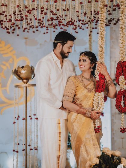 A collection of moments from bride Ishwarya's Muhurtham. Her golden wedding saree was draped to be both photogenic and practical for the various ceremonies of a traditional South Indian wedding.