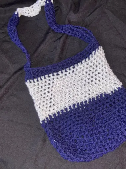 My handmade mesh bag in blue and white. The open stitch makes it super lightweight and perfect for summer.