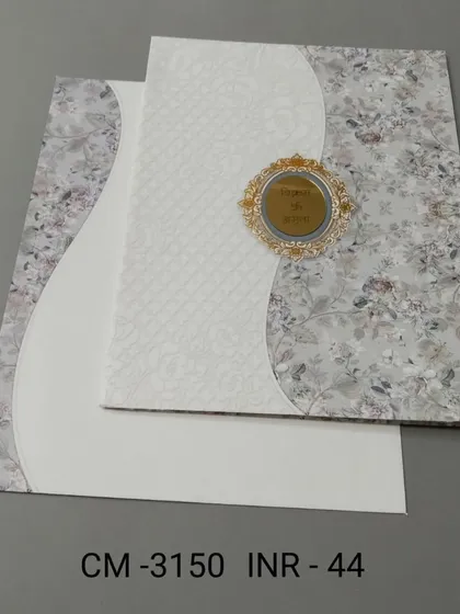 A modern invitation with a unique curved design, combining a floral pattern with a clean white, textured paper. The central gold emblem adds a touch of luxury.