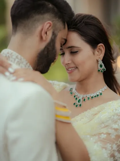 A close, intimate portrait capturing the deep connection between the couple. This shot from a Mumbai wedding shoot focuses on their gentle expressions and the soft, natural light, creating a timeless and emotional image.