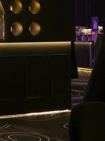 The clean lines and ambient lighting of the bar area, showcasing our focus on sleek and modern event design.
