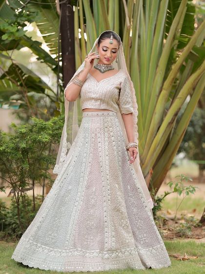 Another angle of this graceful bride. The makeup is flawless from every side, ensuring she looks perfect in all her wedding photos.