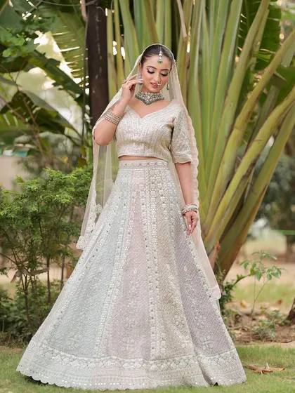 Another angle of this graceful bride. The makeup is flawless from every side, ensuring she looks perfect in all her wedding photos.