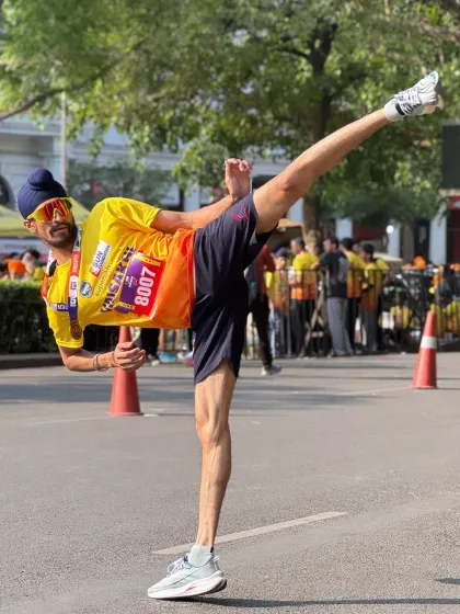Flexibility and power in action. Executing a high kick during the Super Sikh Run event, showing how martial arts discipline and athletic conditioning can be applied across different sports.
