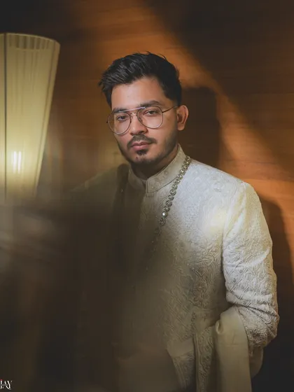 A moody and artistic portrait of the groom. The creative use of motion blur and shadow adds a modern, edgy feel to this stylish shot.