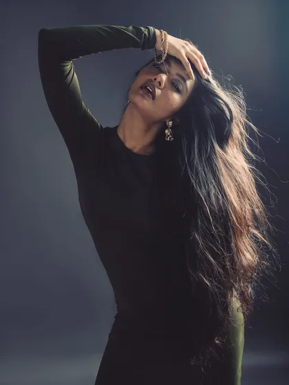 Creating a sense of movement and freedom in the studio. The flowing hair adds a dynamic, ethereal quality to the portrait.
