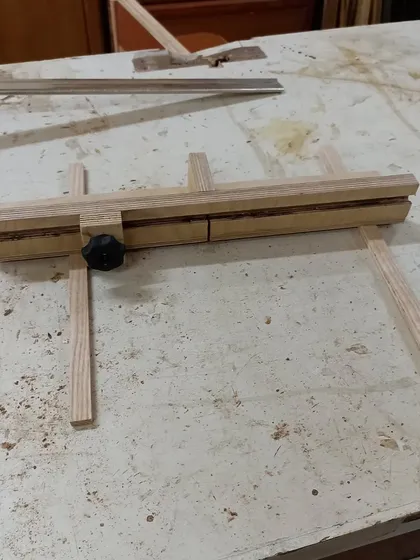 A mini crosscut sled I made for my table saw. This jig allows for safe and accurate cross-grain cuts, especially on small pieces.
