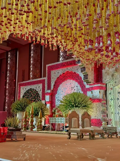 A side view of the magnificent mandap. The layers of decor, from the floral arrangements to the structured backdrops, showcase the depth and complexity of our traditional designs.