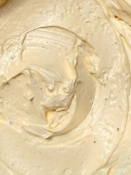 The texture of my vanilla bean buttercream, swirled and ready to frost a cake. You can see the little specks of real vanilla.