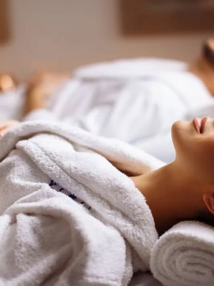 Our 'Sibling Bliss' offer is designed for you to pamper your sibling. This image of a couple's massage shows the kind of shared relaxation experience you can gift.