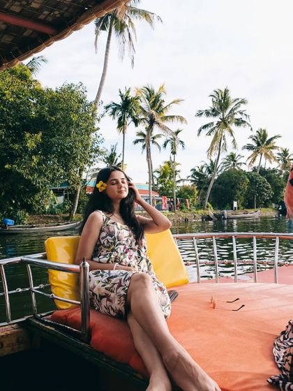 A yellow flower in my hair adds the perfect finishing touch to this Kerala look. I believe in small details that tie an entire outfit together and connect it to the location.