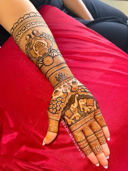 A full arm view of the bridal design with elephants and peacocks.