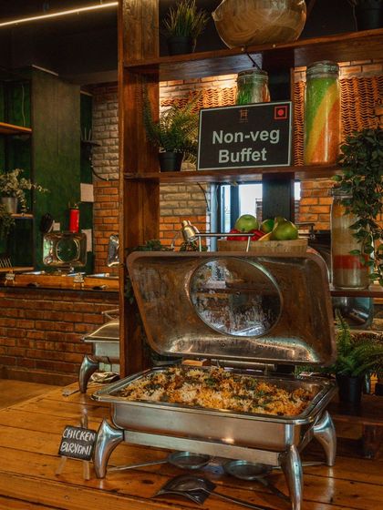 A shot of the non-veg buffet, featuring a delicious chicken biryani that's perfect for refueling your team.