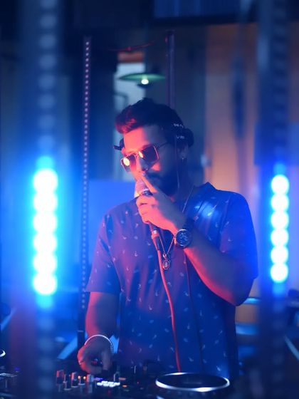 On the mic, connecting with the crowd. Music is a universal language.